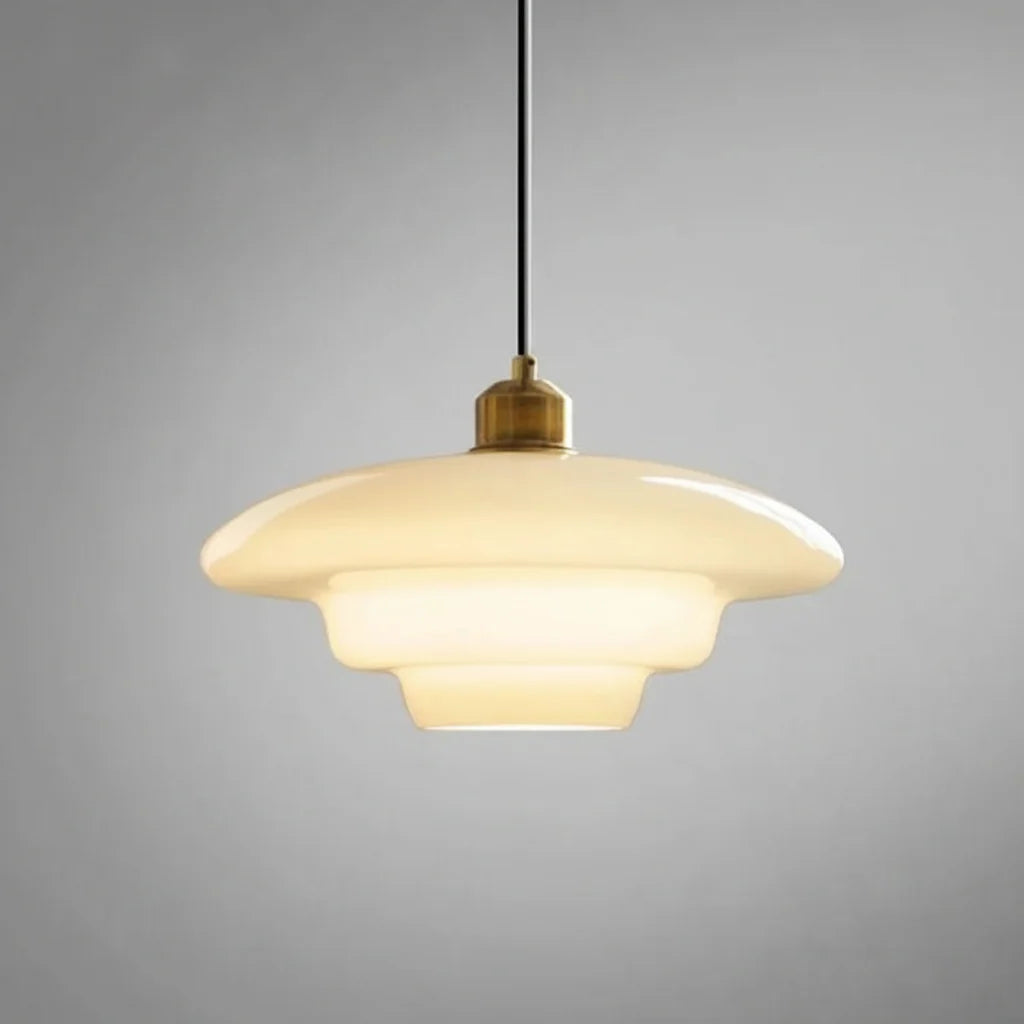Stylish modern pendant light featuring glass and brass accents, ideal for kitchen settings. Dimensions: 12 x 12 x 16 inches. Lur 0