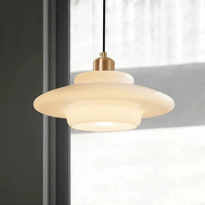 Stylish modern pendant light featuring glass and brass accents, ideal for kitchen settings. Dimensions: 12 x 12 x 16 inches. Lur 4