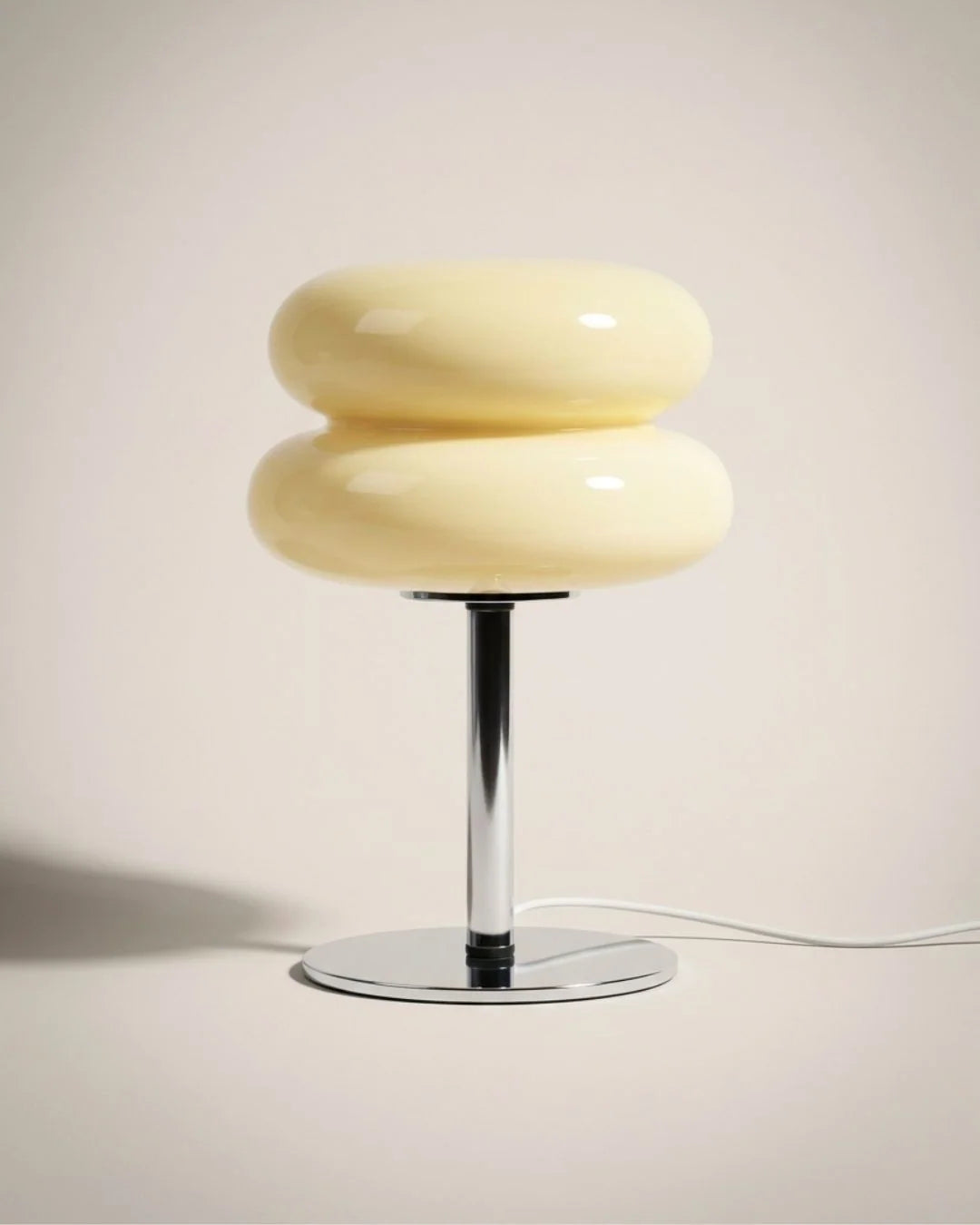 Modern glass table lamp with a polished chrome base, perfect for a nightstand or living room, dimensions 15"x5". 10
