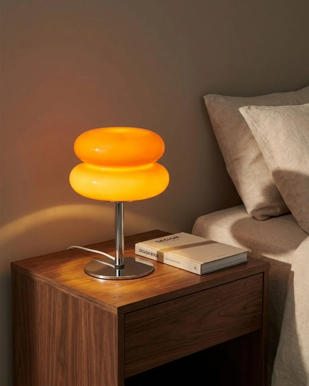 Modern glass table lamp with a polished chrome base, perfect for a nightstand or living room, dimensions 15"x5". 5