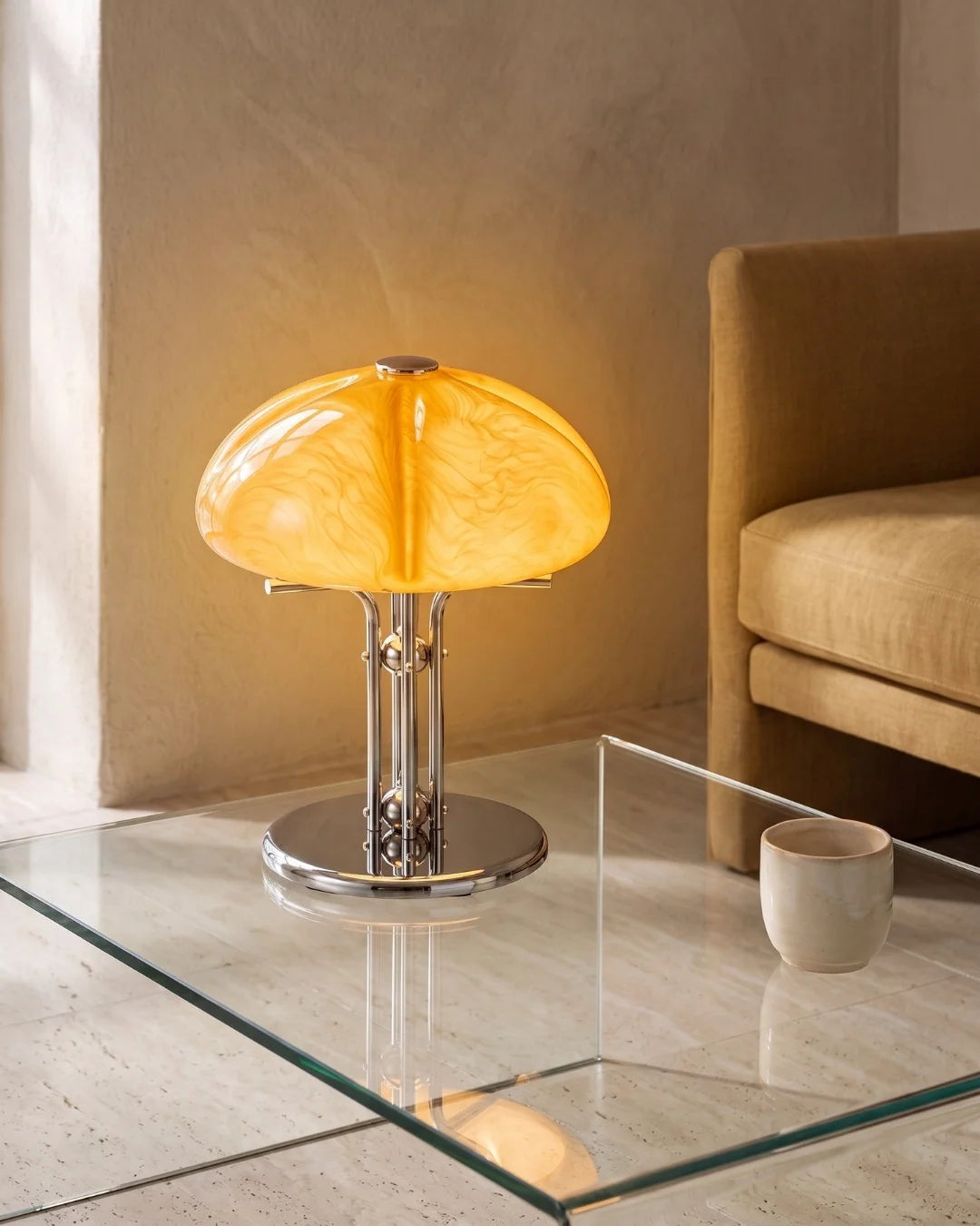 Amber glass lamp on glass coffee table
