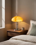 Amber glass lamp on nightstand