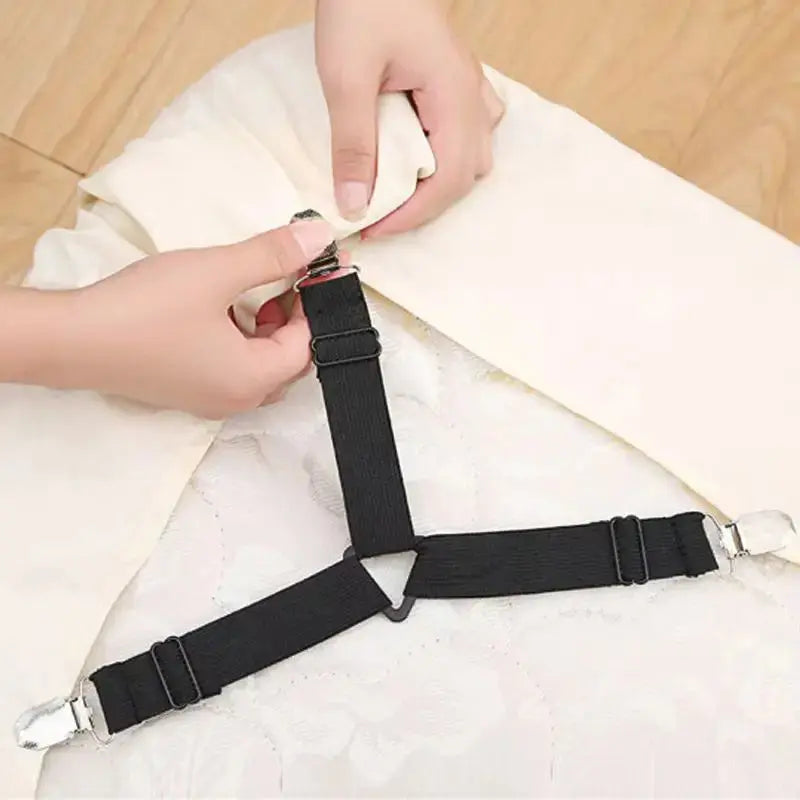 Attaching sheet strap clip to mattress corner