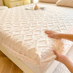 Beige coral fleece fitted sheet on bed