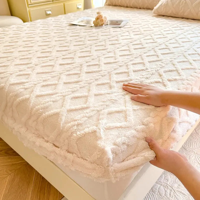 Beige coral fleece fitted sheet on bed