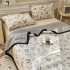 Black and white butterfly bedding set on bed