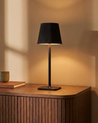 Black cordless lamp on sideboard