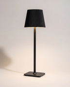 Black cordless table lamp with pleated shade