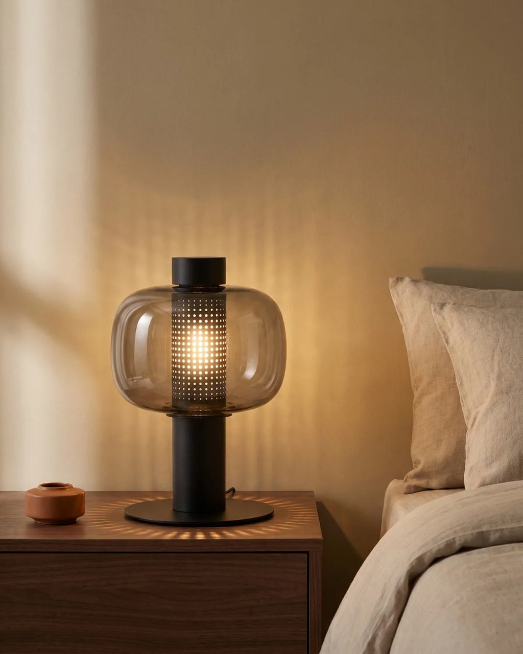 Black lantern lamp on nightstand