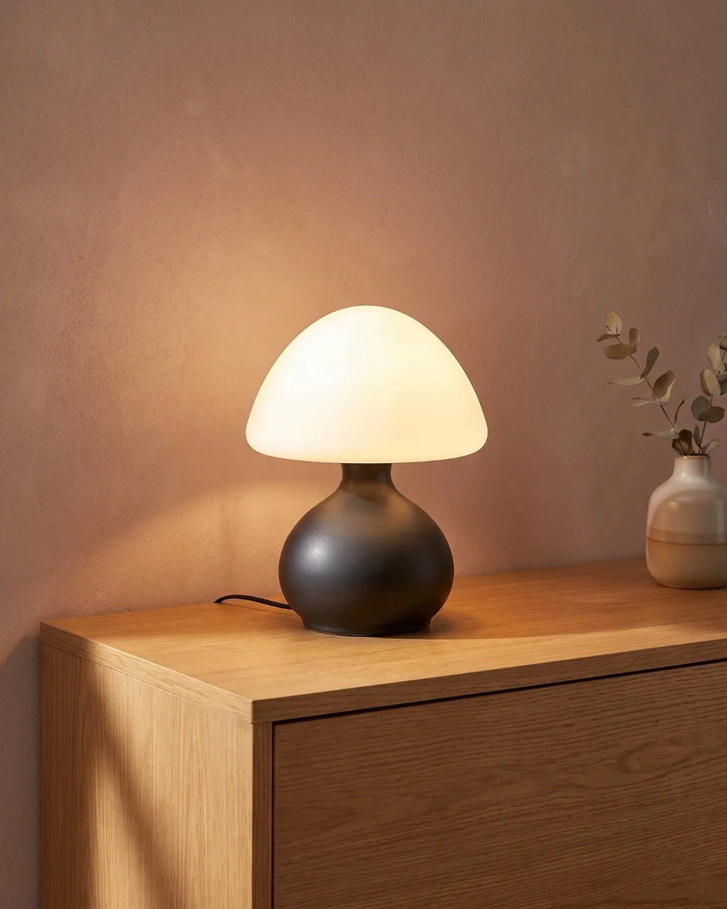Black mushroom lamp on console
