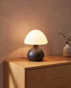 Black mushroom lamp on console