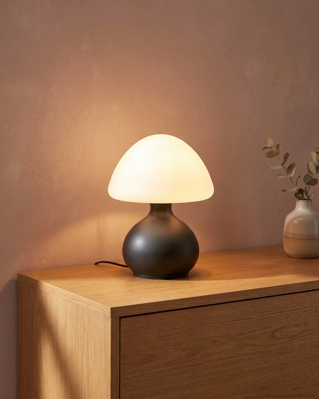 Black mushroom lamp on console