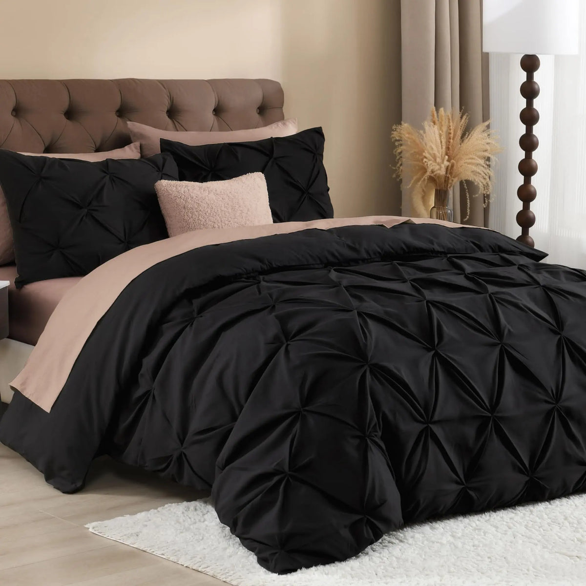Black pinch pleat duvet cover set on bed