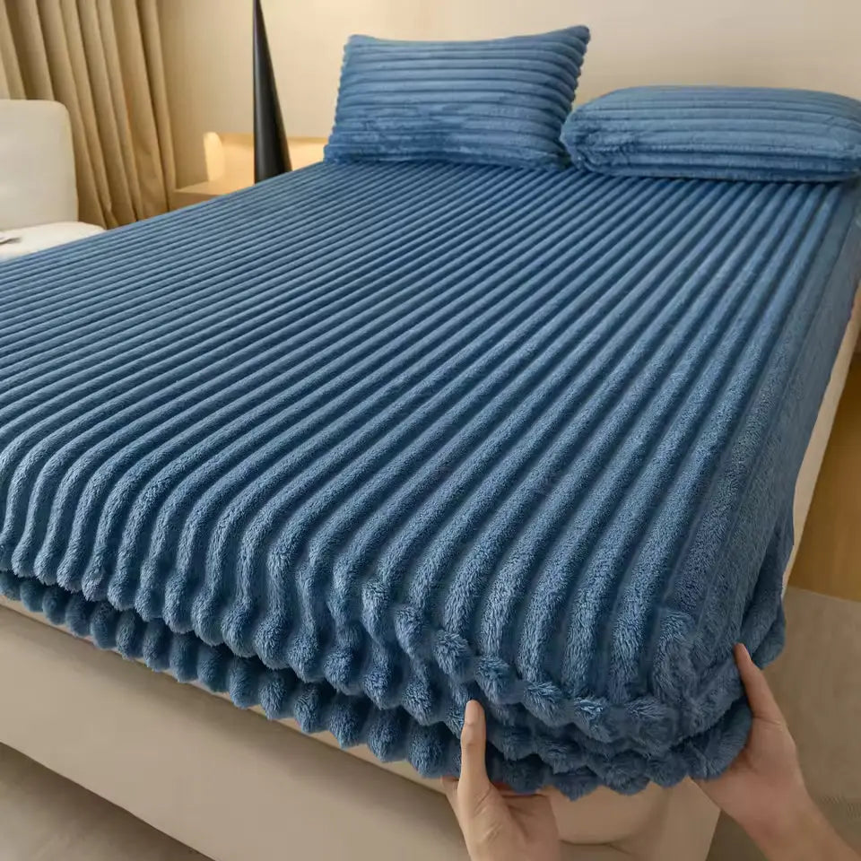 Blue faux fur fitted sheet on bed