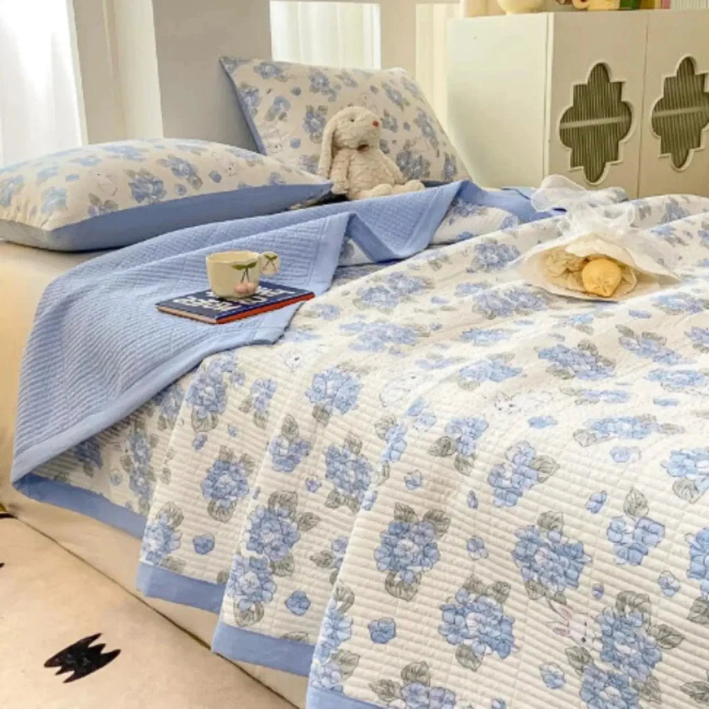 Blue floral bedding set on bed