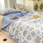 Blue floral bedding set on bed