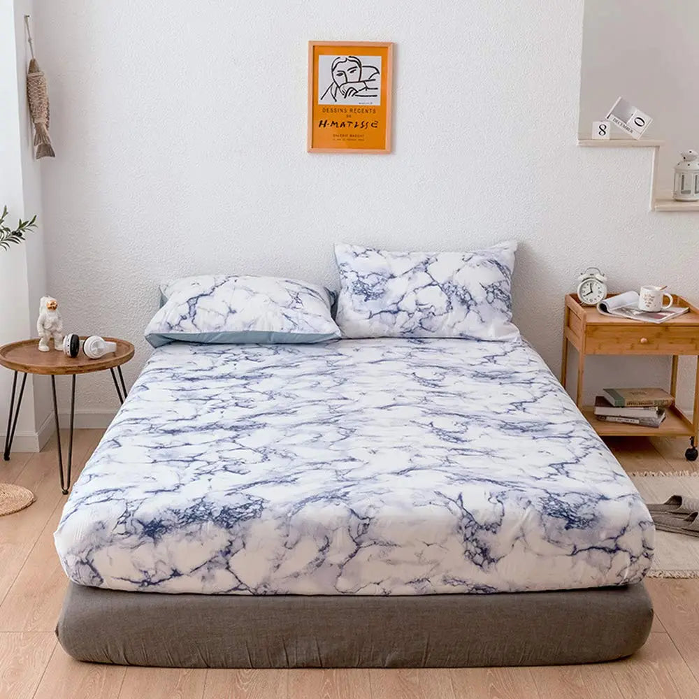 Blue marble fitted sheet on bed