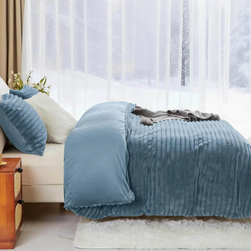 Blue striped fleece duvet cover on bed
