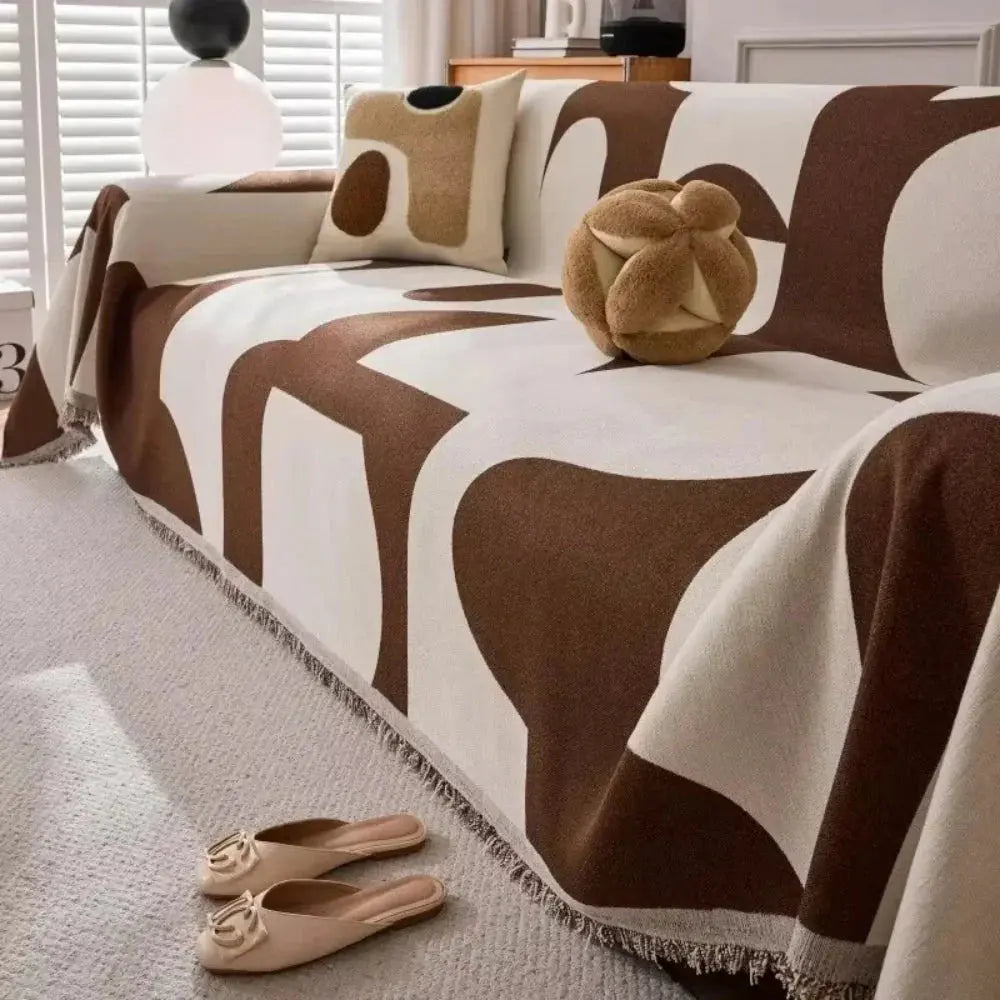 Brown and cream geometric chenille couch cover on sofa