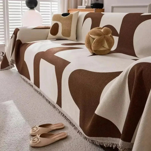 Brown and cream geometric chenille couch cover on sofa