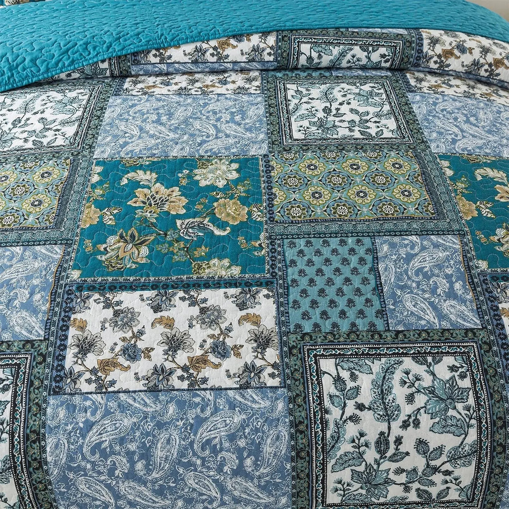 Close-up of blue floral patchwork squares