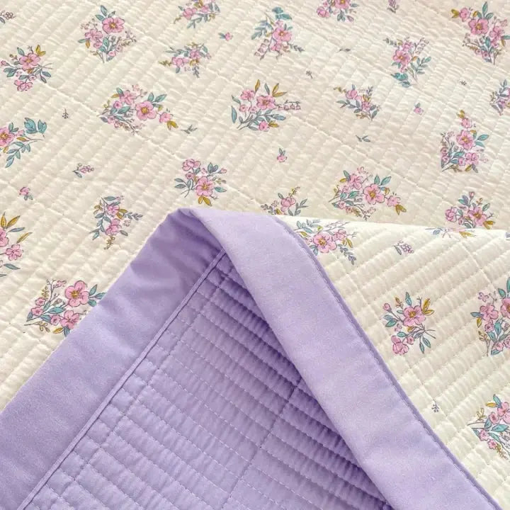 Close-up of floral print with purple reverse
