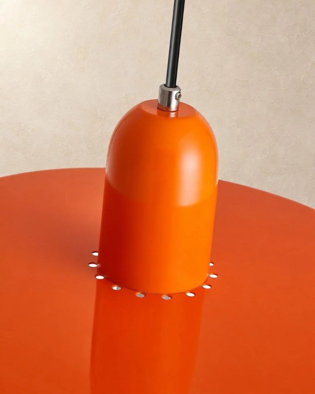 Close-up of orange pendant holder