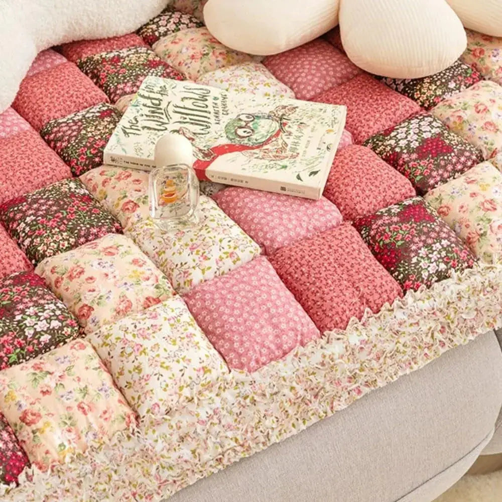 Close-up of pink floral quilted pet mat