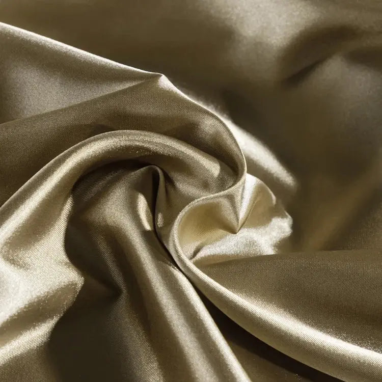 Close-up of silky champagne satin fabric