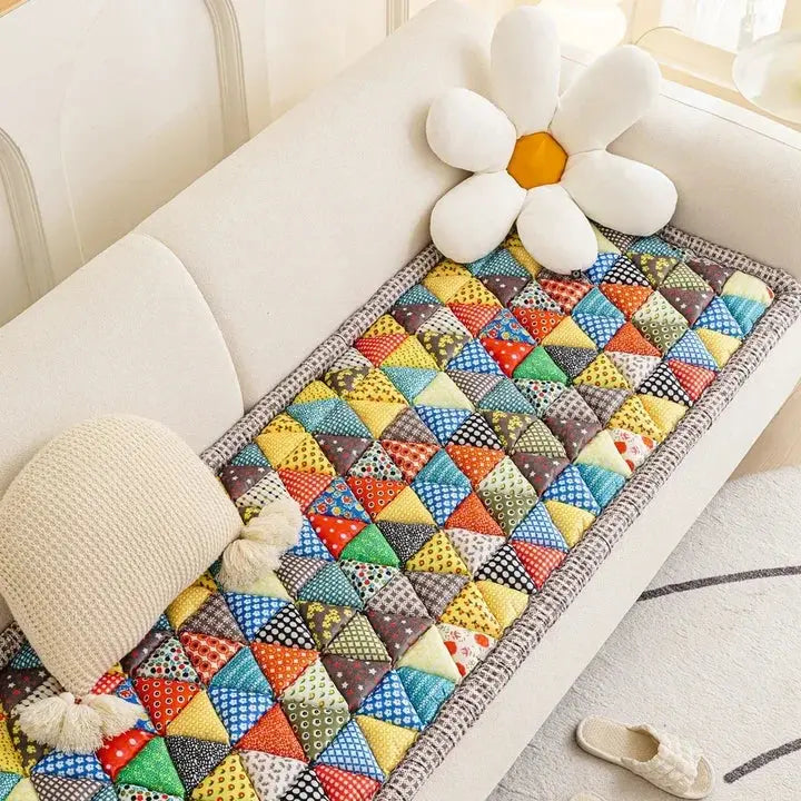 Colorful patchwork sofa seat protector close-up