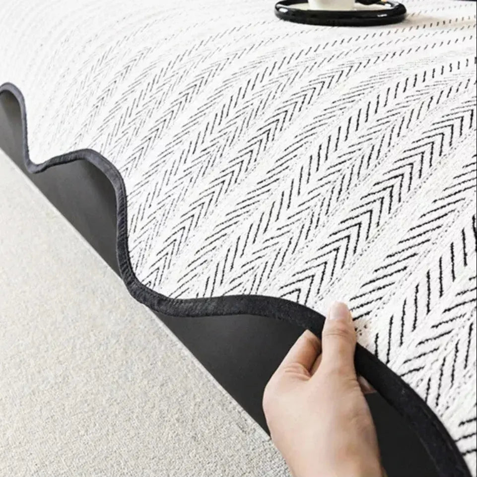 Scalloped edge and non-slip backing of couch cover