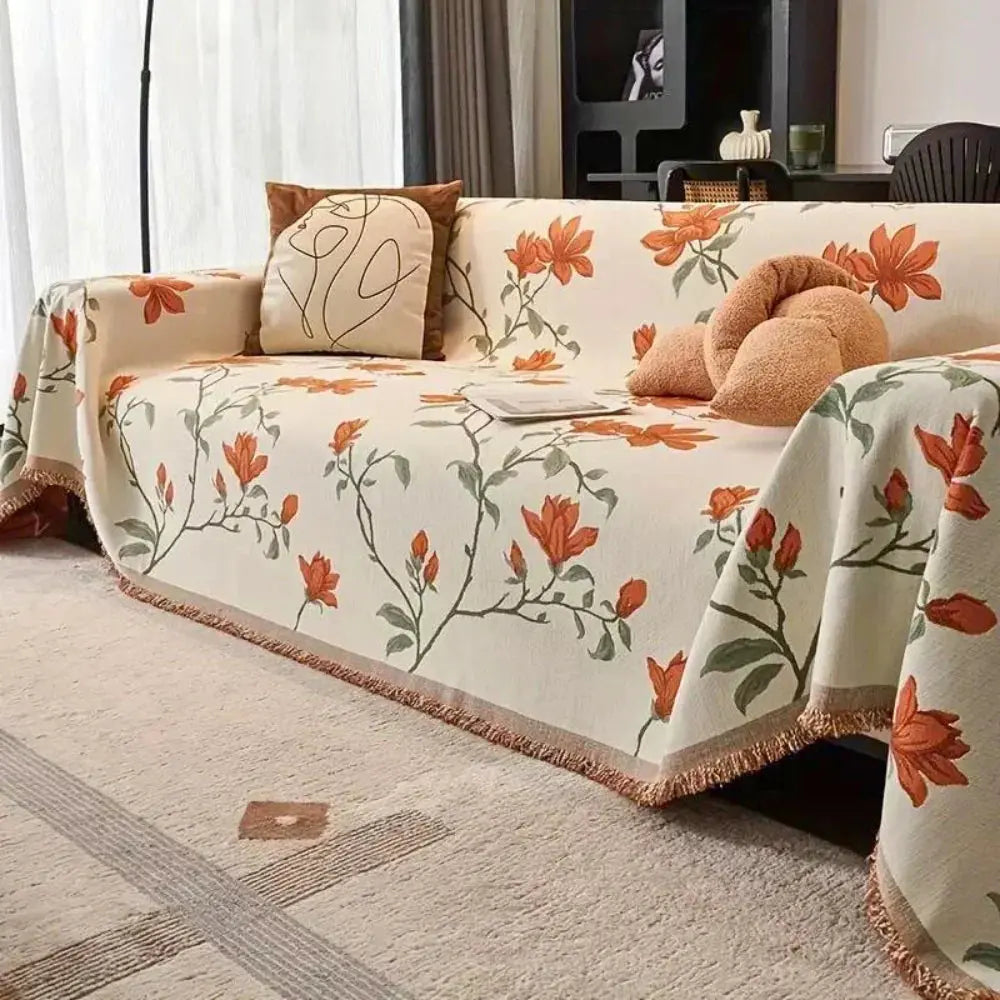 Cream boho chenille couch cover with orange floral pattern