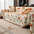 Cream boho chenille couch cover with orange floral pattern