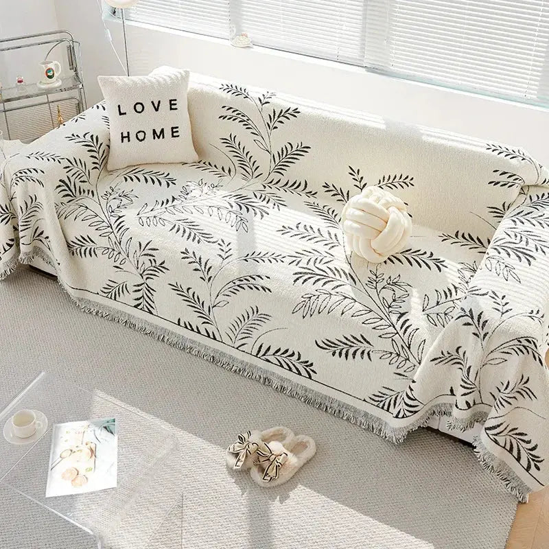 Dark green leaf chenille couch cover on sofa