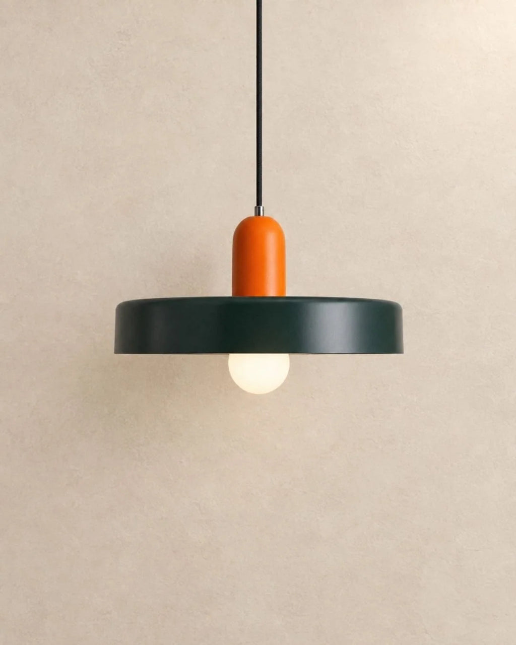 Dark green pendant light with orange holder