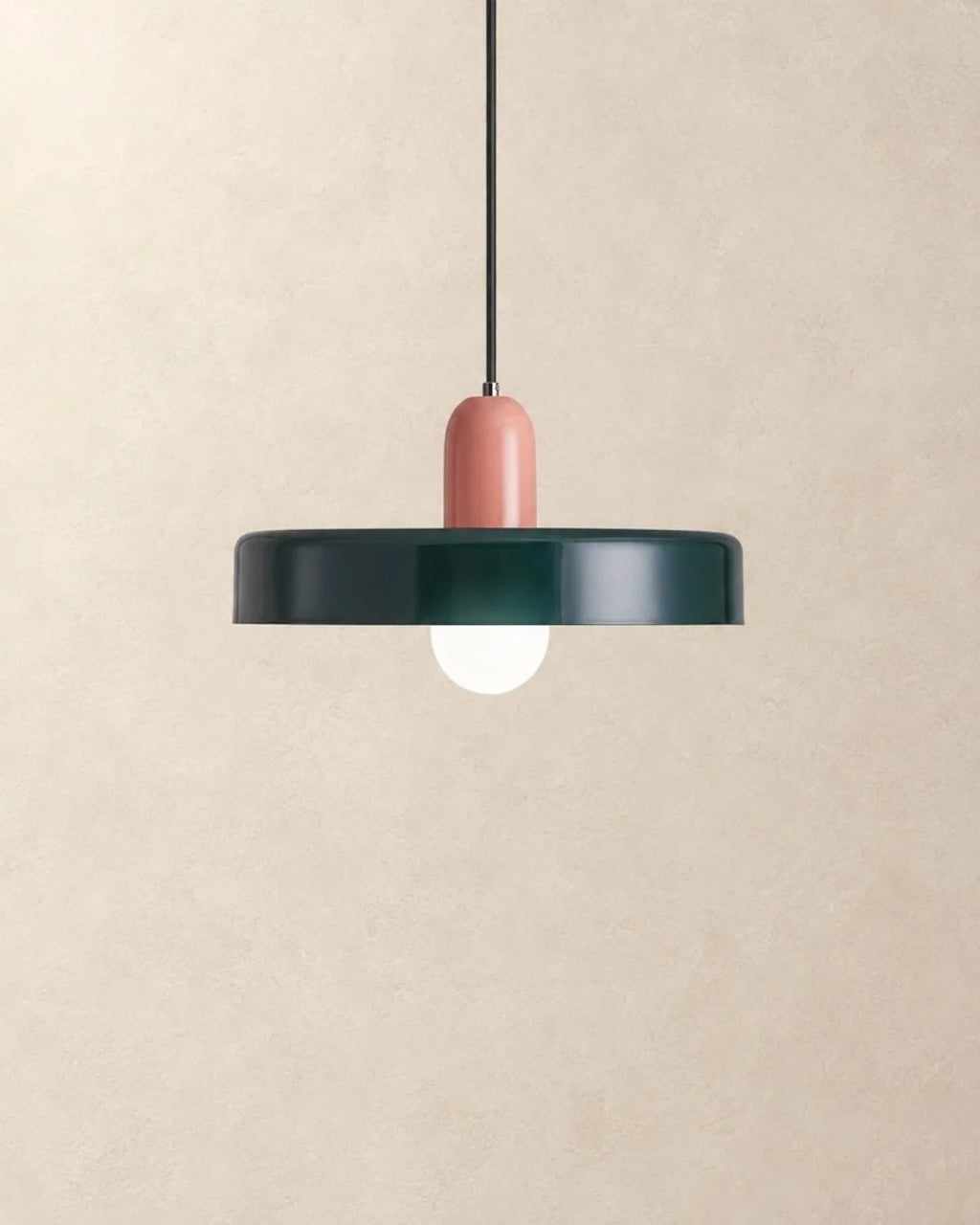 Dark green pendant light with pink holder