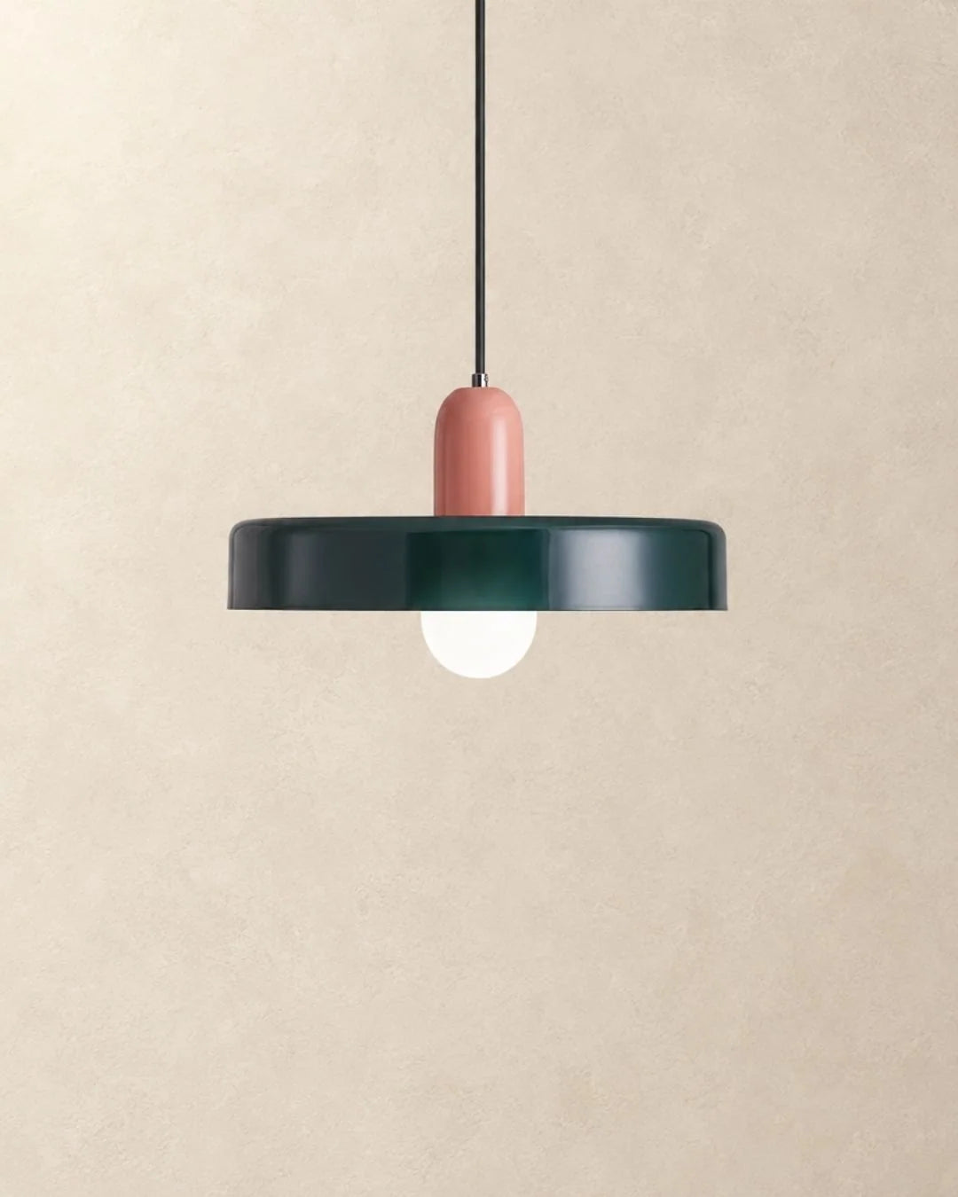 Dark green pendant light with pink holder
