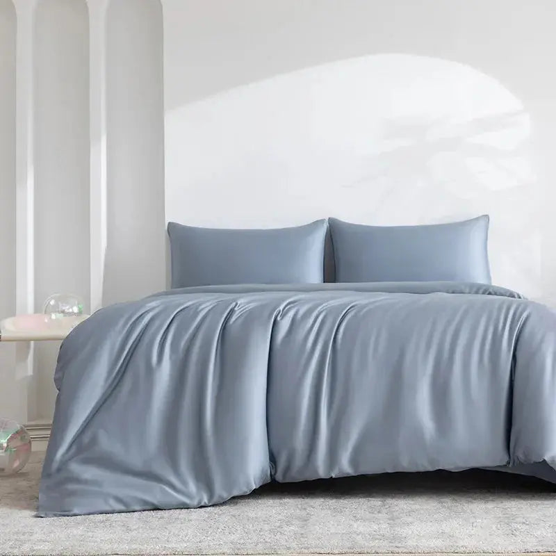 Dusty blue bamboo sheet set on bed