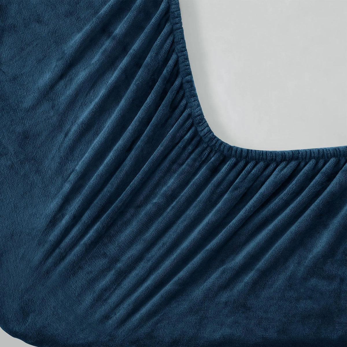 Elastic corner of navy fleece fitted sheet