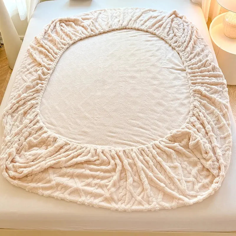 Elastic edges of coral fleece fitted sheet