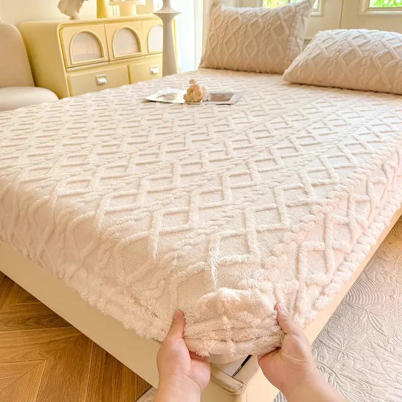 Fitting beige coral fleece sheet on mattress