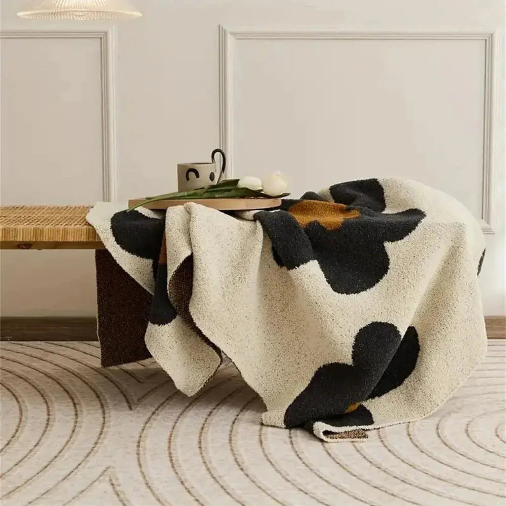Floral fleece throw on bench