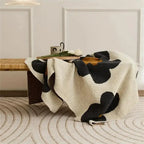 Floral fleece throw on bench