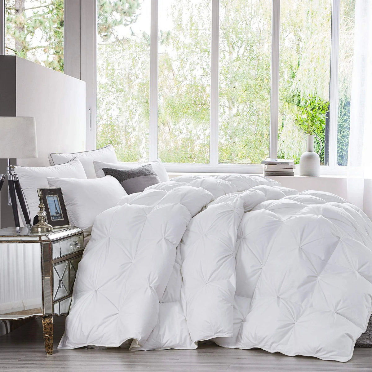 Fluffy goose down comforter on bed by window