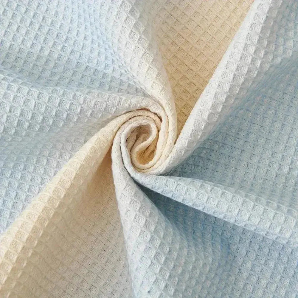 Folded blue and cream waffle couch cover fabric