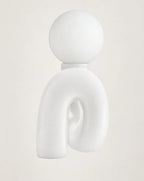 Front view of white wavy lamp base