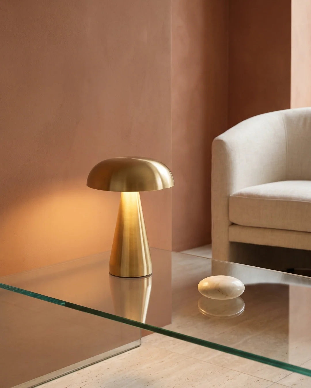 Gold cordless lamp on glass table