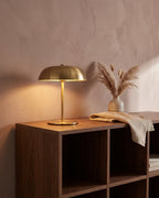 Gold cordless lamp on shelf