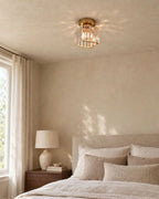 Gold crystal ceiling light in bedroom