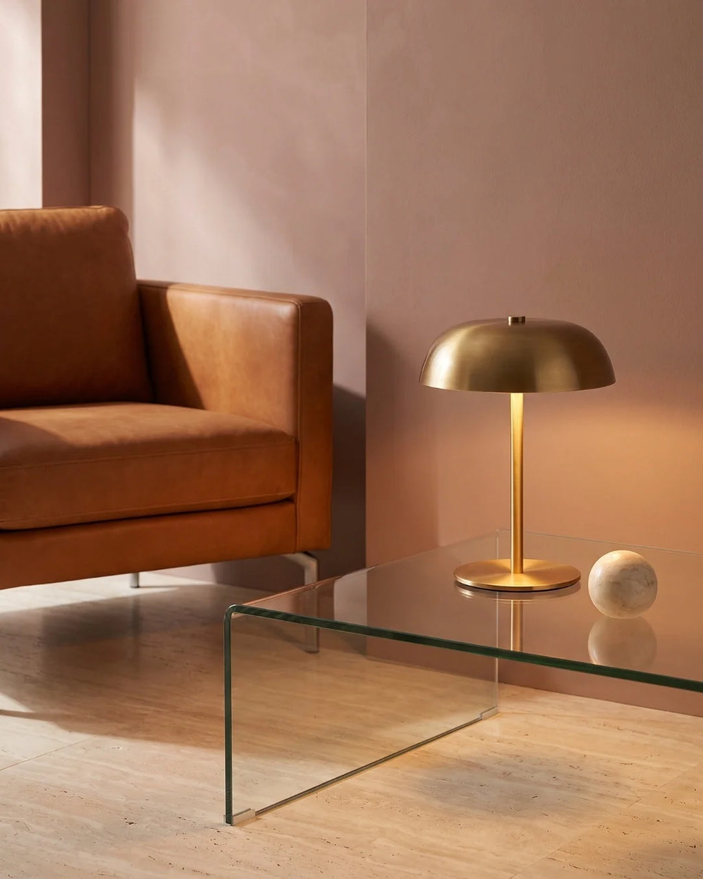 Gold lamp on glass coffee table